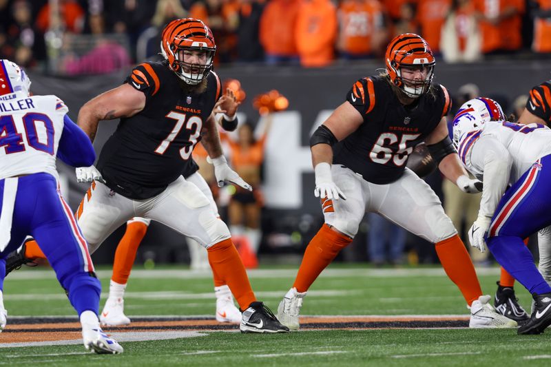 Cincinnati Bengals offensive tackle Jonah Williams (73) and guard Alex Cappa (65) in action during an NFL football game against the Buffalo Bills, Sunday, Nov. 5, 2023, in Cincinnati. (AP Photo/Gary McCullough)