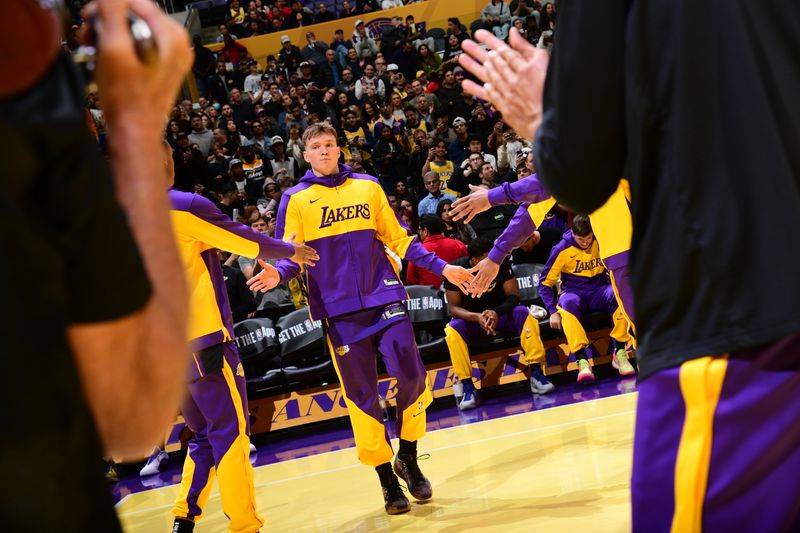 LOS ANGELES, CA - NOVEMBER 29: Dalton Knecht #4 of the Los Angeles Lakers is introduced before the game against the Oklahoma City Thunder during a Emirates NBA Cup game on October 22, 2024 at Crypto.Com Arena in Los Angeles, California. NOTE TO USER: User expressly acknowledges and agrees that, by downloading and/or using this Photograph, user is consenting to the terms and conditions of the Getty Images License Agreement. Mandatory Copyright Notice: Copyright 2024 NBAE (Photo by Adam Pantozzi/NBAE via Getty Images)