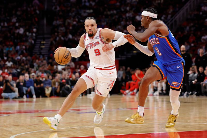 HOUSTON, TEXAS - DECEMBER 06: Dillon Brooks #9 of the Houston Rockets drives ahead of Shai Gilgeous-Alexander #2 of the Oklahoma City Thunder during the second half at Toyota Center on December 06, 2023 in Houston, Texas. NOTE TO USER: User expressly acknowledges and agrees that, by downloading and or using this photograph, User is consenting to the terms and conditions of the Getty Images License Agreement.? (Photo by Carmen Mandato/Getty Images)