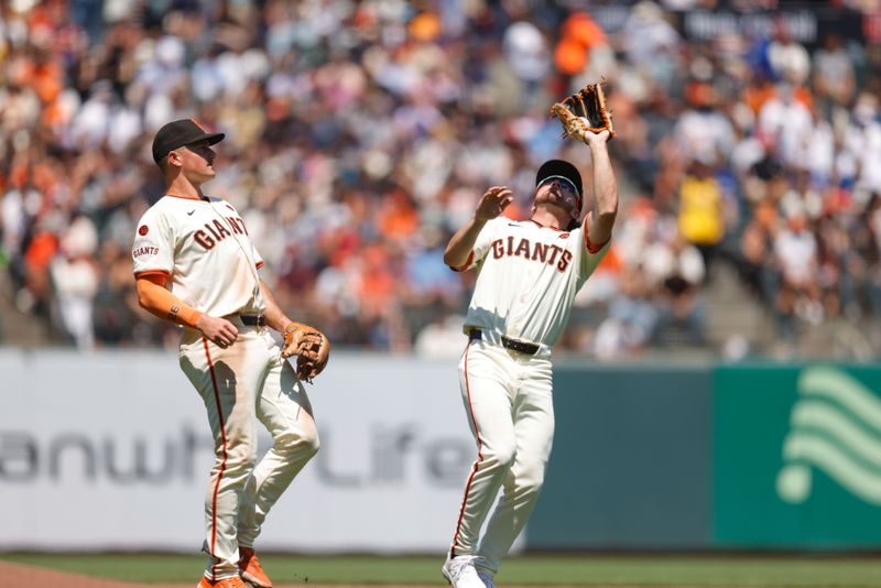 Jul 11, 2024; San Francisco, California, USA; San Francisco Giants shortstop Brett Wisely (0) catches a pop up during the seventh inning against the Toronto Blue Jays at Oracle Park. Mandatory Credit: Sergio Estrada-USA TODAY Sports