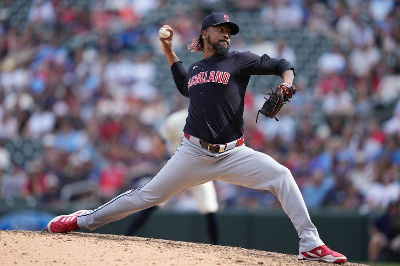 Aug 11, 2024; Minneapolis, Minnesota, USA; Cleveland Guardians relief pitcher Emmanuel Clase (48) delivers a pitch during the ninth inning against the Minnesota Twins at Target Field. Mandatory Credit: Jordan Johnson-USA TODAY Sports
