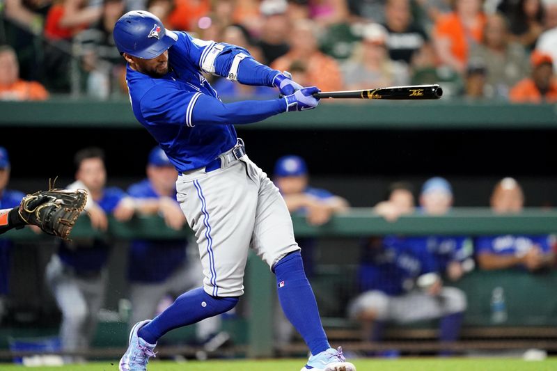 Aug 24, 2023; Baltimore, Maryland, USA; Toronto Blue Jays outfielder George Springer (4) drives in a run in the fourth inning against the Baltimore Orioles at Oriole Park at Camden Yards. Mandatory Credit: Mitch Stringer-USA TODAY Sports