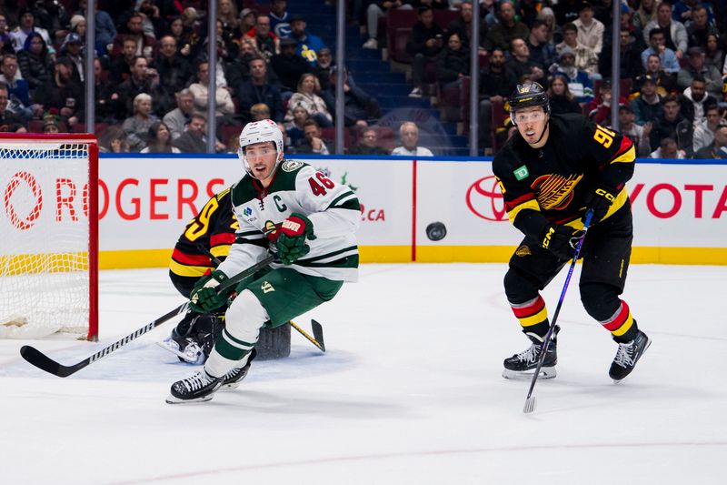 Dec 7, 2023; Vancouver, British Columbia, CAN; Minnesota Wild defenseman Jared Spurgeon (46) and Vancouver Canucks defenseman Nikita Zadorov (91) follw the rebound in the second period at Rogers Arena. Mandatory Credit: Bob Frid-USA TODAY Sports