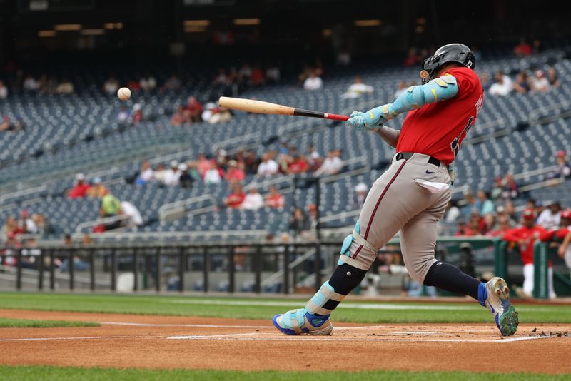 Sep 16, 2025; Washington, District of Columbia, USA; Atlanta Braves outfielder Ronald Acuña Jr. (13) singles against the Washington Nationals during the first inning at Nationals Park. Mandatory Credit: Geoff Burke-Imagn Images