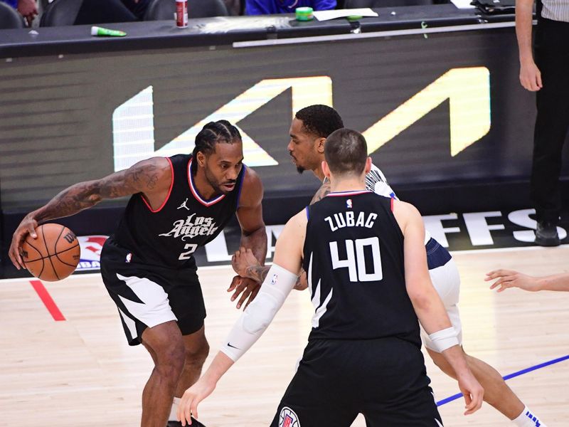 LOS ANGELES, CA - APRIL 23: Kawhi Leonard #2 of the LA Clippers handles the ball during the game  against the Dallas Mavericks during Round 1 Game 2 of the 2024 NBA Playoffs on April 23, 2024 at Crypto.Com Arena in Los Angeles, California. NOTE TO USER: User expressly acknowledges and agrees that, by downloading and/or using this Photograph, user is consenting to the terms and conditions of the Getty Images License Agreement. Mandatory Copyright Notice: Copyright 2024 NBAE (Photo by Adam Pantozzi/NBAE via Getty Images)