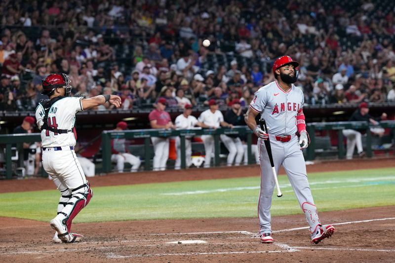 Jun 13, 2024; Phoenix, Arizona, USA; Los Angeles Angels outfielder Jo Adell (7) reacts after striking out against the Arizona Diamondbacks during the fifth inning at Chase Field. Mandatory Credit: Joe Camporeale-USA TODAY Sports