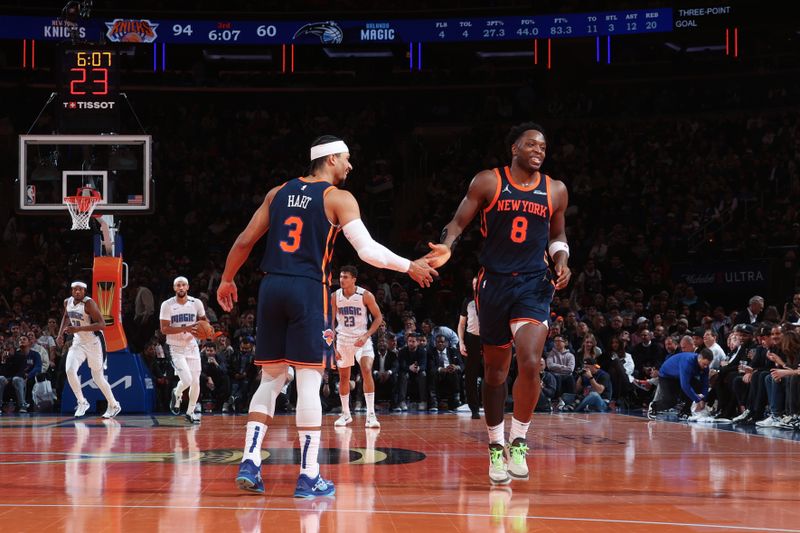 NEW YORK, NY - DECEMBER 3: OG Anunoby #8 and Josh Hart #3 of the New York Knicks high five during the game against the Orlando Magic during the Emirates NBA Cup on December 3, 2024 at Madison Square Garden in New York City, New York.  NOTE TO USER: User expressly acknowledges and agrees that, by downloading and or using this photograph, User is consenting to the terms and conditions of the Getty Images License Agreement. Mandatory Copyright Notice: Copyright 2024 NBAE  (Photo by Nathaniel S. Butler/NBAE via Getty Images)