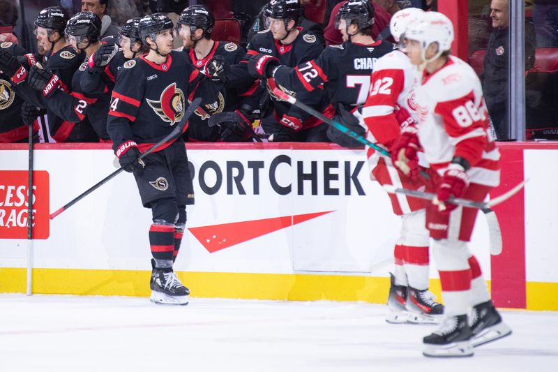 Jan 5, 2026; Ottawa, Ontario, CAN; Ottawa Senators center Dylan Cozens (24) celebrates with team his goal scored in the second period against the Detroit Red Wings  at the Canadian Tire Centre. Mandatory Credit: Marc DesRosiers-IMAGN Images