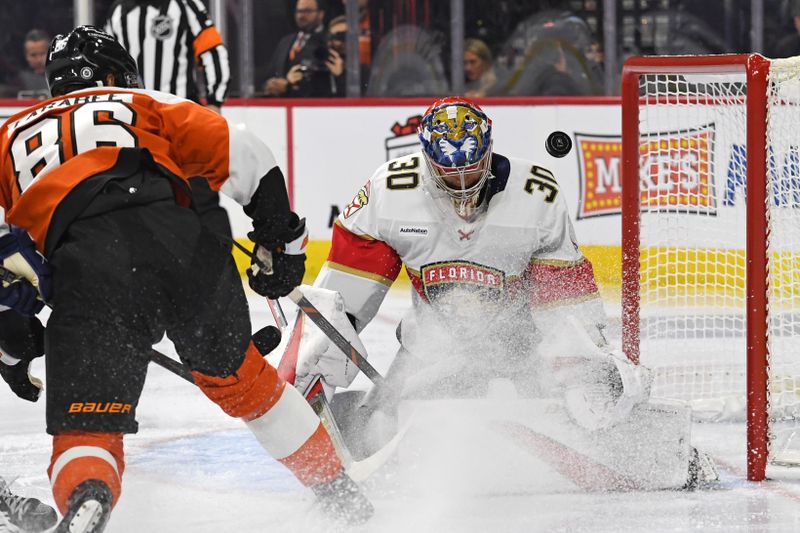 Dec 5, 2024; Philadelphia, Pennsylvania, USA; Florida Panthers goaltender Spencer Knight (30) makes a save against Philadelphia Flyers left wing Joel Farabee (86) during the first period at Wells Fargo Center. Mandatory Credit: Eric Hartline-Imagn Images