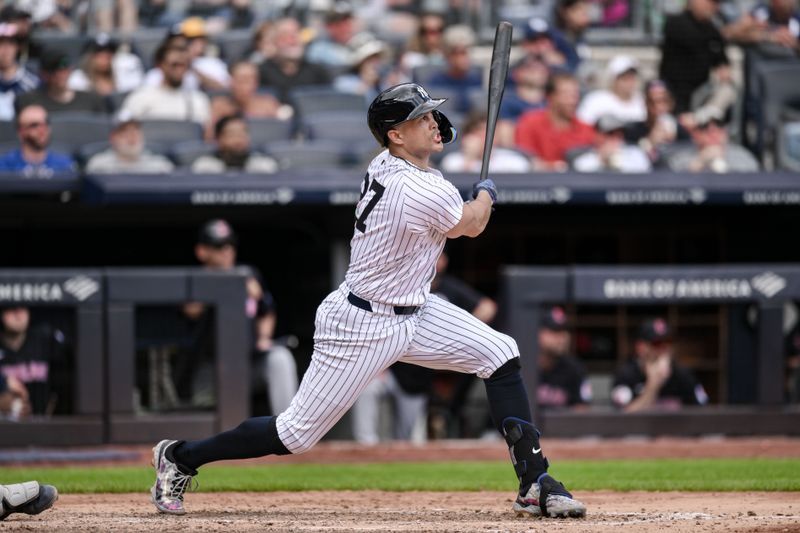 Aug 22, 2024; Bronx, New York, USA; New York Yankees designated hitter Giancarlo Stanton (27) hits a three run home run against the Cleveland Guardians during the fifth inning at Yankee Stadium. Mandatory Credit: John Jones-USA TODAY Sports