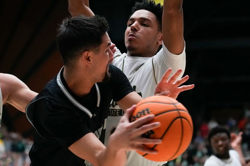 Feb 27, 2024; Fort Collins, Colorado, USA; Nevada Wolf Pack guard Jarod Lucas (2) looks to pass the ball with Colorado State Rams guard Josiah Strong (3) defending during the second half at Moby Arena. Mandatory Credit: Michael Madrid-USA TODAY Sports