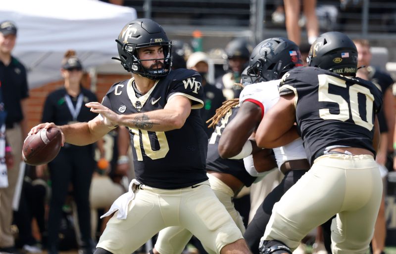 Oct 2, 2021; Winston-Salem, North Carolina, USA;  Wake Forest Demon Deacons quarterback Sam Hartman (10) throws a pass as offensive lineman Zach Tom (50) blocks during the first quarter against the Louisville Cardinals at Truist Field. Mandatory Credit: Reinhold Matay-USA TODAY Sports