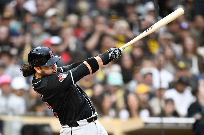 Jun 8, 2024; San Diego, California, USA;  Arizona Diamondbacks third baseman Eugenio Suarez (28) hits an RBI single during the fifth inning against the San Diego Padres at Petco Park. Mandatory Credit: Denis Poroy-USA TODAY Sports at Petco Park. 