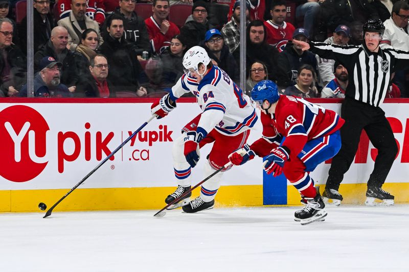 Jan 19, 2025; Montreal, Quebec, CAN; New York Rangers center Adam Edstrom (84) plays the puck agianst Montreal Canadiens defenseman Lane Hutson (48) during the third period at Bell Centre. Mandatory Credit: David Kirouac-Imagn Images
