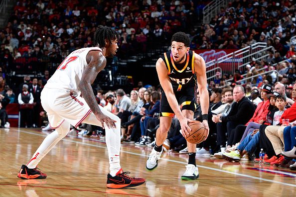 HOUSTON, TX - DECEMBER 27:   Devin Booker #1 of the Phoenix Suns handles the ball during the game against the Houston Rockets on December 27, 2023 at the Toyota Center in Houston, Texas. NOTE TO USER: User expressly acknowledges and agrees that, by downloading and or using this photograph, User is consenting to the terms and conditions of the Getty Images License Agreement. Mandatory Copyright Notice: Copyright 2023 NBAE (Photo by Logan Riely/NBAE via Getty Images)