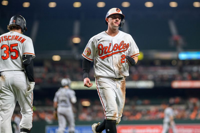 Aug 29, 2023; Baltimore, Maryland, USA; Baltimore Orioles left fielder Austin Hays (21) scores a run during the fifth inning against the Chicago White Sox at Oriole Park at Camden Yards. Mandatory Credit: Reggie Hildred-USA TODAY Sports