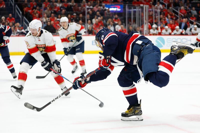 Nov 8, 2023; Washington, District of Columbia, USA; Washington Capitals left wing Alex Ovechkin (8) shoots the puck as Florida Panthers defenseman Dmitry Kulikov (7) defends in the third period at Capital One Arena. Mandatory Credit: Geoff Burke-USA TODAY Sports