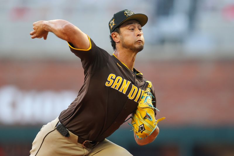 May 19, 2024; Atlanta, Georgia, USA; San Diego Padres starting pitcher Yu Darvish (11) throws against the Atlanta Braves in the first inning at Truist Park. Mandatory Credit: Brett Davis-USA TODAY Sports