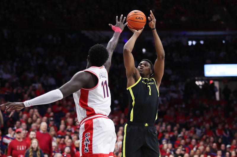 Feb 2, 2023; Tucson, Arizona, USA; Oregon Ducks center N'Faly Dante (1) makes a shot against Arizona Wildcats center Oumar Ballo (11) in the first half at McKale Center. Mandatory Credit: Zachary BonDurant-USA TODAY Sports