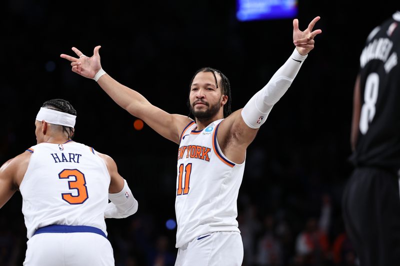 NEW YORK, NEW YORK - JANUARY 23: Jalen Brunson #11 of the New York Knicks reacts after making a three pointer during the fourth quarter of the game against the Brooklyn Nets at Barclays Center on January 23, 2024 in New York City.  NOTE TO USER: User expressly acknowledges and agrees that, by downloading and or using this photograph, User is consenting to the terms and conditions of the Getty Images License Agreement. (Photo by Dustin Satloff/Getty Images)