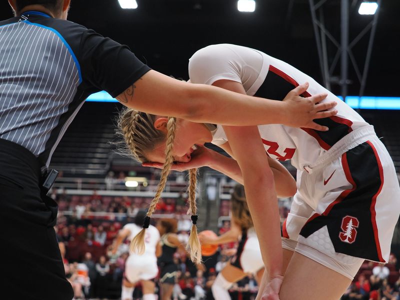 Jan 22, 2023; Stanford, California, USA; The referee puts their arm around Stanford Cardinal forward Cameron Brink (22) after a play against the Colorado Buffaloes during the second quarter at Maples Pavilion. Mandatory Credit: Kelley L Cox-USA TODAY Sports