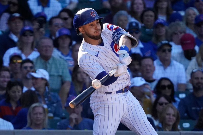 Sep 9, 2023; Chicago, Illinois, USA; Chicago Cubs third baseman Nick Madrigal (1) hits a double against the Arizona Diamondbacks during the ninth inning at Wrigley Field. Mandatory Credit: David Banks-USA TODAY Sports