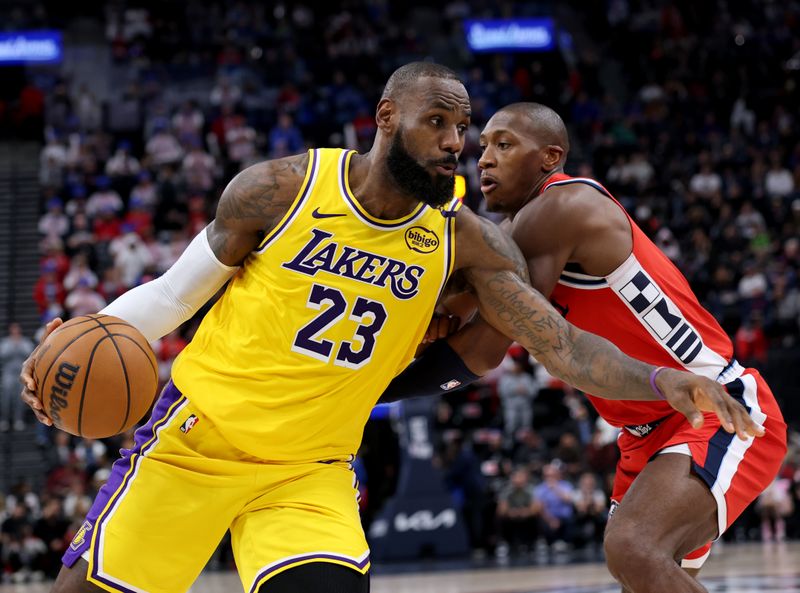 INGLEWOOD, CALIFORNIA - FEBRUARY 04: LeBron James #23 of the Los Angeles Lakers spins to the basket on Kris Dunn #8 of the LA Clippers during a 122-97 Lakers win at Intuit Dome on February 04, 2025 in Inglewood, California. (Photo by Harry How/Getty Images) User expressly acknowledges and agrees that, by downloading and or using this photograph, User is consenting to the terms and conditions of the Getty Images License Agreement. (Photo by Harry How/Getty Images)