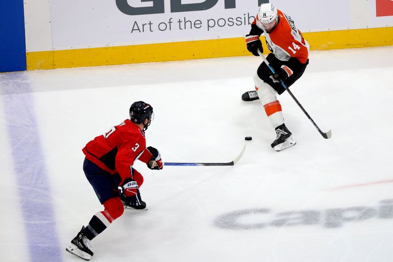 Mar 20, 2025; Washington, District of Columbia, USA; Philadelphia Flyers center Sean Couturier (14) tries to slip past Washington Capitals defenseman Matt Roy (3) during the second period at Capital One Arena. Mandatory Credit: Daniel Kucin Jr.-Imagn Images