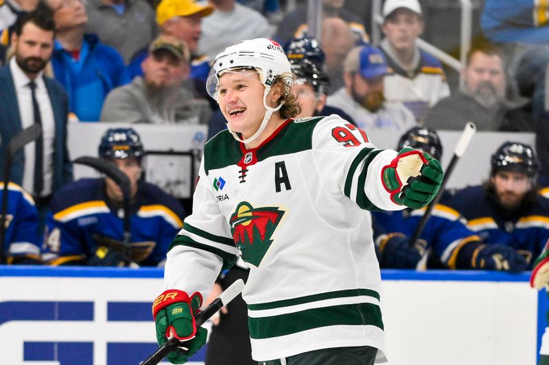 Nov 19, 2024; St. Louis, Missouri, USA;  Minnesota Wild left wing Kirill Kaprizov (97) reacts after scoring against the St. Louis Blues during the third period at Enterprise Center. Mandatory Credit: Jeff Curry-Imagn Images