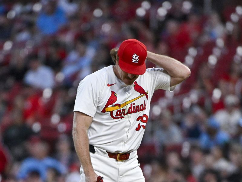 May 7, 2024; St. Louis, Missouri, USA;  St. Louis Cardinals starting pitcher Miles Mikolas (39) reacts after giving up a game tying three run home run to New York Mets center fielder Brandon Nimmo (not pictured) during the fifth inning at Busch Stadium. Mandatory Credit: Jeff Curry-USA TODAY Sports