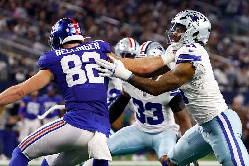 Dallas Cowboys linebacker Micah Parsons (11) works against New York Giants tight end Daniel Bellinger (82) during the second half of an NFL football game in Arlington, Texas, Sunday, Nov. 12, 2023. (AP Photo/Roger Steinman)