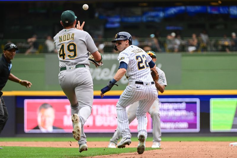 Jun 10, 2023; Milwaukee, Wisconsin, USA; Milwaukee Brewers left fielder Christian Yelich (22) is caught in a rundown between Oakland Athletes first baseman Ryan Noda (49) and second baseman Jace Peterson (6) in the third inning at American Family Field. Mandatory Credit: Benny Sieu-USA TODAY Sports