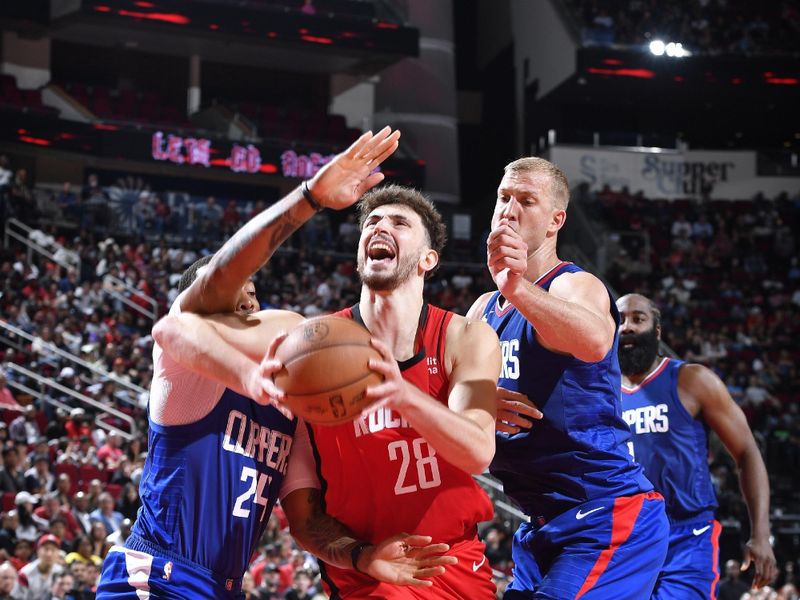 HOUSTON, TX - MARCH 6: Alperen Sengun #28 of the Houston Rockets drives to the basket during the game against the LA Clippers on March 6, 2024 at the Toyota Center in Houston, Texas. NOTE TO USER: User expressly acknowledges and agrees that, by downloading and or using this photograph, User is consenting to the terms and conditions of the Getty Images License Agreement. Mandatory Copyright Notice: Copyright 2024 NBAE (Photo by Logan Riely/NBAE via Getty Images)