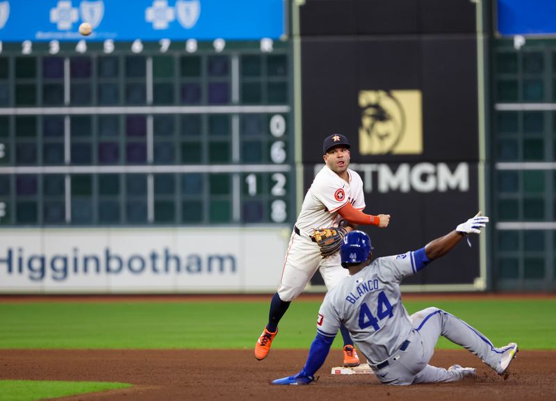 Aug 29, 2024; Houston, Texas, USA;  Houston Astros second baseman Jose Altuve (27) turns a double play against Kansas City Royals pitch runner Dairon Blanco in the eighth inning at Minute Maid Park. Mandatory Credit: Thomas Shea-USA TODAY Sports