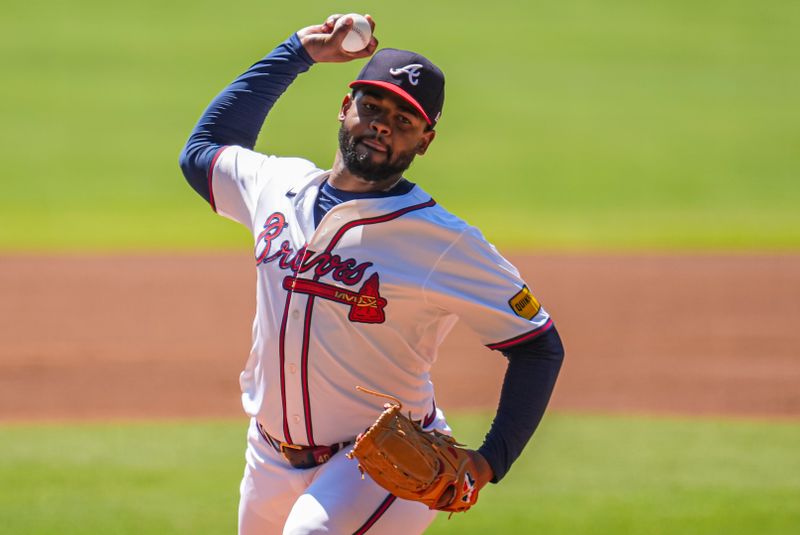 Aug 25, 2024; Cumberland, Georgia, USA; Atlanta Braves starting pitcher Reynaldo Lopez (40) pitches against the Washington Nationals during the first inning at Truist Park. Mandatory Credit: Dale Zanine-USA TODAY Sports