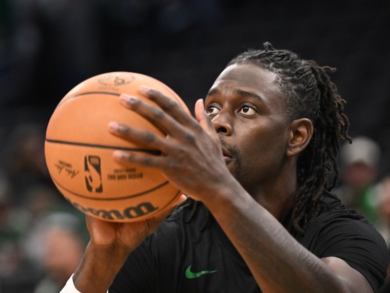 BOSTON, MASSACHUSETTS - JANUARY 13: Jrue Holiday #4 of the Boston Celtics takes a shot during warmups before a game against the Houston Rockets at the TD Garden on January 13, 2024 in Boston, Massachusetts. NOTE TO USER: User expressly acknowledges and agrees that, by downloading and or using this photograph, User is consenting to the terms and conditions of the Getty Images License Agreement. (Photo by Brian Fluharty/Getty Images)