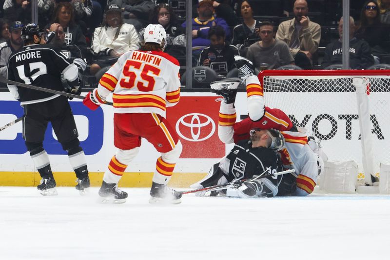 Dec 23, 2023; Los Angeles, California, USA; Calgary Flames center Blake Coleman (20) falls over Los Angeles Kings goaltender Cam Talbot (39) after scoring a goal during the second period of a game at Crypto.com Arena. Mandatory Credit: Jessica Alcheh-USA TODAY Sports