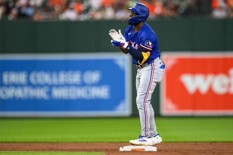 Jun 30, 2024; Baltimore, Maryland, USA; Texas Rangers outfielder Adolis García (53) reacts after hitting a double during the fifth inning against the Baltimore Orioles at Oriole Park at Camden Yards. Mandatory Credit: Reggie Hildred-USA TODAY Sports