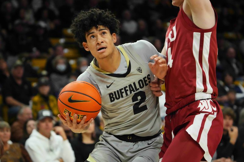 Jan 22, 2023; Boulder, Colorado, USA; Washington State Cougars guard Justin Powell (24) blocks the advance of Colorado Buffaloes guard KJ Simpson (2) in the first half at the CU Events Center. Mandatory Credit: Ron Chenoy-USA TODAY Sports