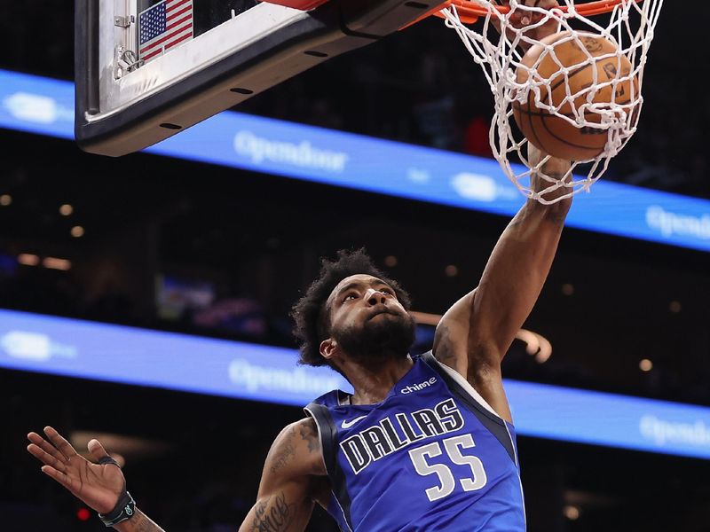 PHOENIX, ARIZONA - DECEMBER 25: Derrick Jones Jr. #55 of the Dallas Mavericks slam dunks the ball against the Phoenix Suns during the first half of the NBA game at Footprint Center on December 25, 2023 in Phoenix, Arizona. NOTE TO USER: User expressly acknowledges and agrees that, by downloading and or using this photograph, User is consenting to the terms and conditions of the Getty Images License Agreement.  (Photo by Christian Petersen/Getty Images)