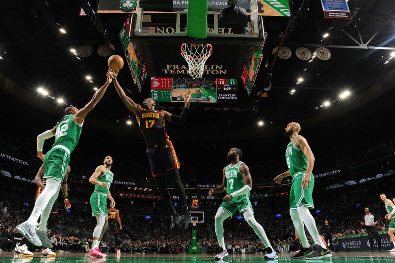 BOSTON, MA - FEBRUARY 7: Onyeka Okongwu #17 of the Atlanta Hawks rebounds the ball during the game against the Boston Celtics on February 7, 2024 at the TD Garden in Boston, Massachusetts. NOTE TO USER: User expressly acknowledges and agrees that, by downloading and or using this photograph, User is consenting to the terms and conditions of the Getty Images License Agreement. Mandatory Copyright Notice: Copyright 2024 NBAE  (Photo by Brian Babineau/NBAE via Getty Images)