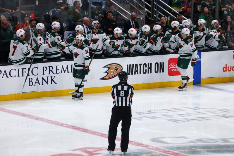 Mar 19, 2024; Anaheim, California, USA; Minnesota Wild right wing Ryan Hartman (38) celebrates with his teammates after scoring a goal during the second period of a game against the Anaheim Ducks at Honda Center. Mandatory Credit: Jessica Alcheh-USA TODAY Sports