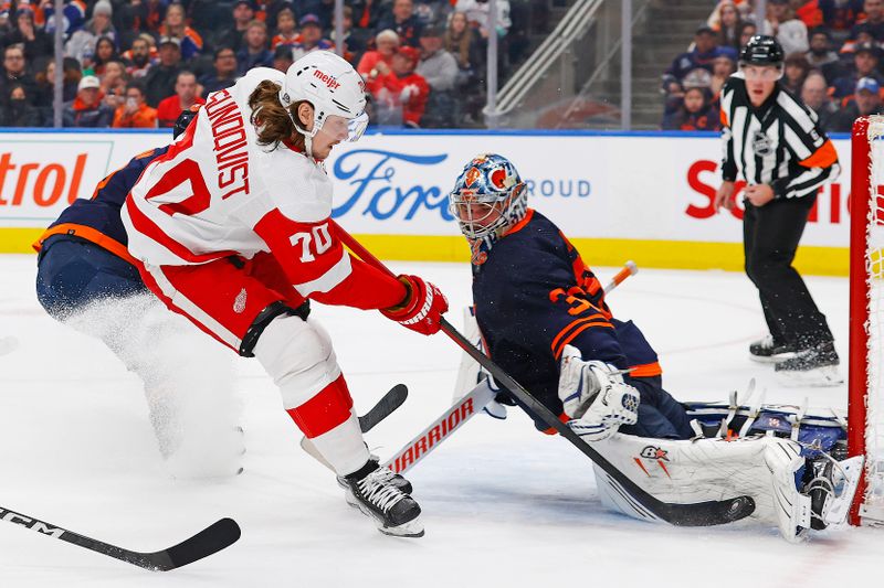 Feb 15, 2023; Edmonton, Alberta, CAN; Edmonton Oilers goaltender Jack Campbell (36) makes a save on Detroit Red Wings forward Oskar Sundqvist (70) during the second period at Rogers Place. Mandatory Credit: Perry Nelson-USA TODAY Sports