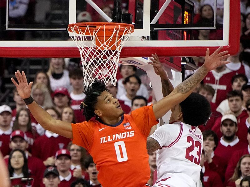 Mar 2, 2024; Madison, WI, USA; Illinois guard Terrence Shannon Jr. (0) fouls Wisconsin guard Chucky Hepburn (23) during the first half of their game Saturday, March 2, 2024 at the Kohl Center in Madison, Wisconsin.
 Mandatory Credit: Mark Hoffman-USA TODAY Sports