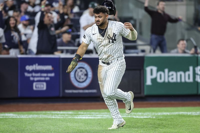 May 18, 2025; Bronx, New York, USA;  New York Yankees designated hitter Jasson Domínguez (24) scores on a throwing error in the eighth inning against the New York Mets at Yankee Stadium. Mandatory Credit: Wendell Cruz-Imagn Images