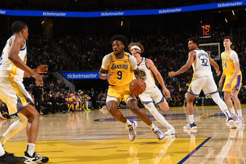 SAN FRANCISCO, CA - OCTOBER 18: Bronny James #9 of the Los Angeles Lakers handles the ball during the game against the Golden State Warriors during a NBA Preseason game on October 18, 2024 at Chase Center in San Francisco, California. NOTE TO USER: User expressly acknowledges and agrees that, by downloading and or using this photograph, user is consenting to the terms and conditions of Getty Images License Agreement. Mandatory Copyright Notice: Copyright 2024 NBAE (Photo by Noah Graham/NBAE via Getty Images)