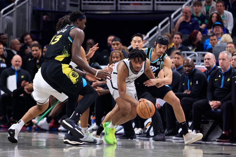 INDIANAPOLIS, INDIANA - MARCH 16: Andrew Nembhard #2 of the Indiana Pacers steals the ball from Cam Thomas #24 of the Brooklyn Nets during the second half at Gainbridge Fieldhouse on March 16, 2024 in Indianapolis, Indiana. NOTE TO USER: User expressly acknowledges and agrees that, by downloading and or using this photograph, User is consenting to the terms and conditions of the Getty Images License Agreement. (Photo by Justin Casterline/Getty Images)