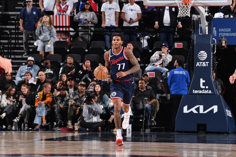 INGLEWOOD, CA - JANUARY 13:  Kevin Porter Jr. #77 of the LA Clippers dribbles the ball during the game against the Miami Heat on January 13, 2025 at Intuit Dome in Los Angeles, California. NOTE TO USER: User expressly acknowledges and agrees that, by downloading and/or using this Photograph, user is consenting to the terms and conditions of the Getty Images License Agreement. Mandatory Copyright Notice: Copyright 2025 NBAE (Photo by Juan Ocampo/NBAE via Getty Images)