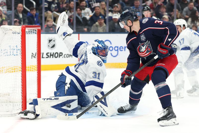 Jan 24, 2026; Columbus, Ohio, USA;  Columbus Blue Jackets center Charlie Coyle (3) shoots the puck as Tampa Bay Lightning goaltender Jonas Johansson (31) makes the save during the second period at Nationwide Arena. Mandatory Credit: Joseph Maiorana-Imagn Images