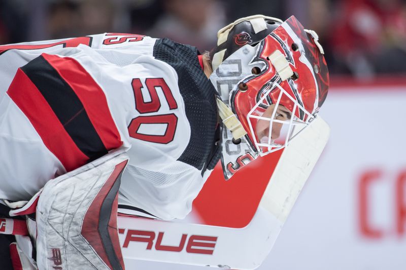 Dec 29, 2023; Ottawa, Ontario, CAN; New Jersey Devils goalie Nico Daws (50) gets focussed prior to the start of the first period against the Ottawa Senators at the Canadian Tire Centre. Mandatory Credit: Marc DesRosiers-USA TODAY Sports